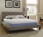 Blue and white closeout bed with wired hand controls in bedroom setting